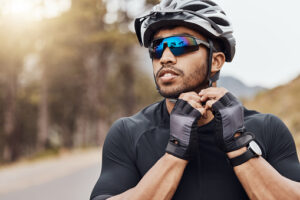 Man with Athletic Eyewear riding a bicycle